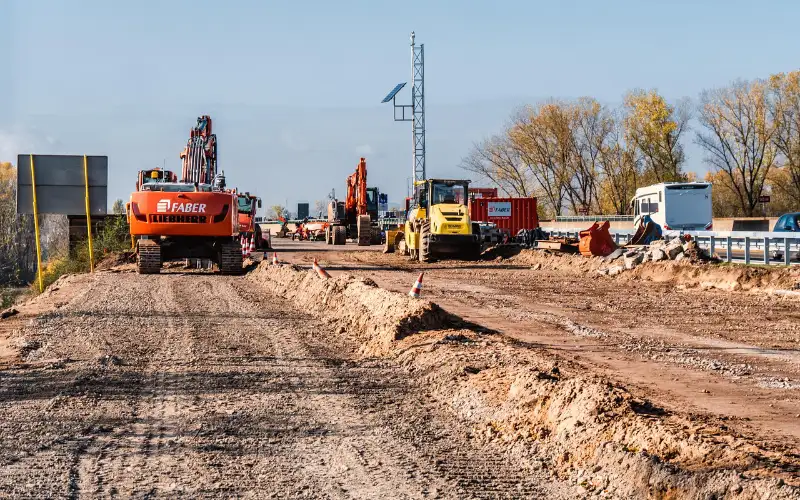 image showing a construction site with heavy machine working