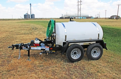 500 gallon water tank trailer positioned for road dust control