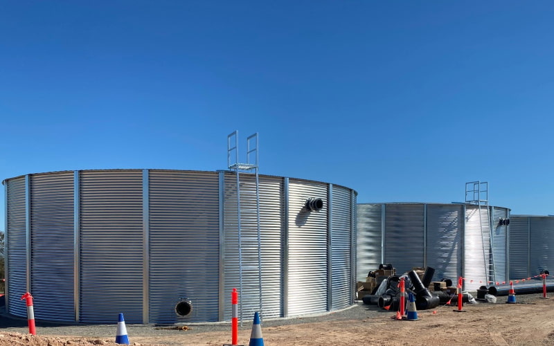 Corrugated panel fire protection tank