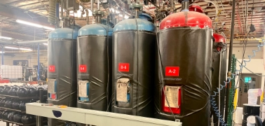 custom blankets installed on blue and red steel tanks