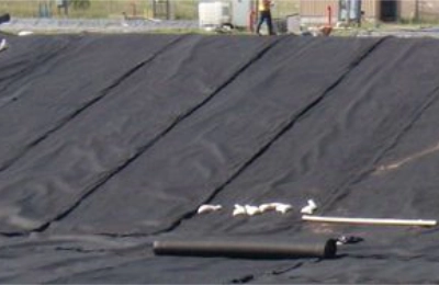 Geotextile fabric used beneath aggregate for soil stabilization