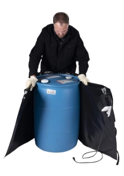 Man wrapping a blue drum with a heater blanket
