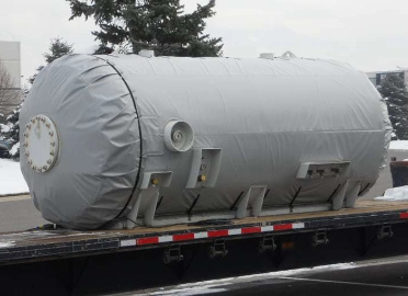 a metal welded tank wrapped in a custom-made heating blanket