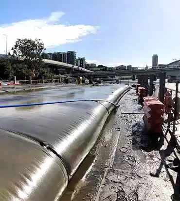 dewatering filter tubes in use on the coast