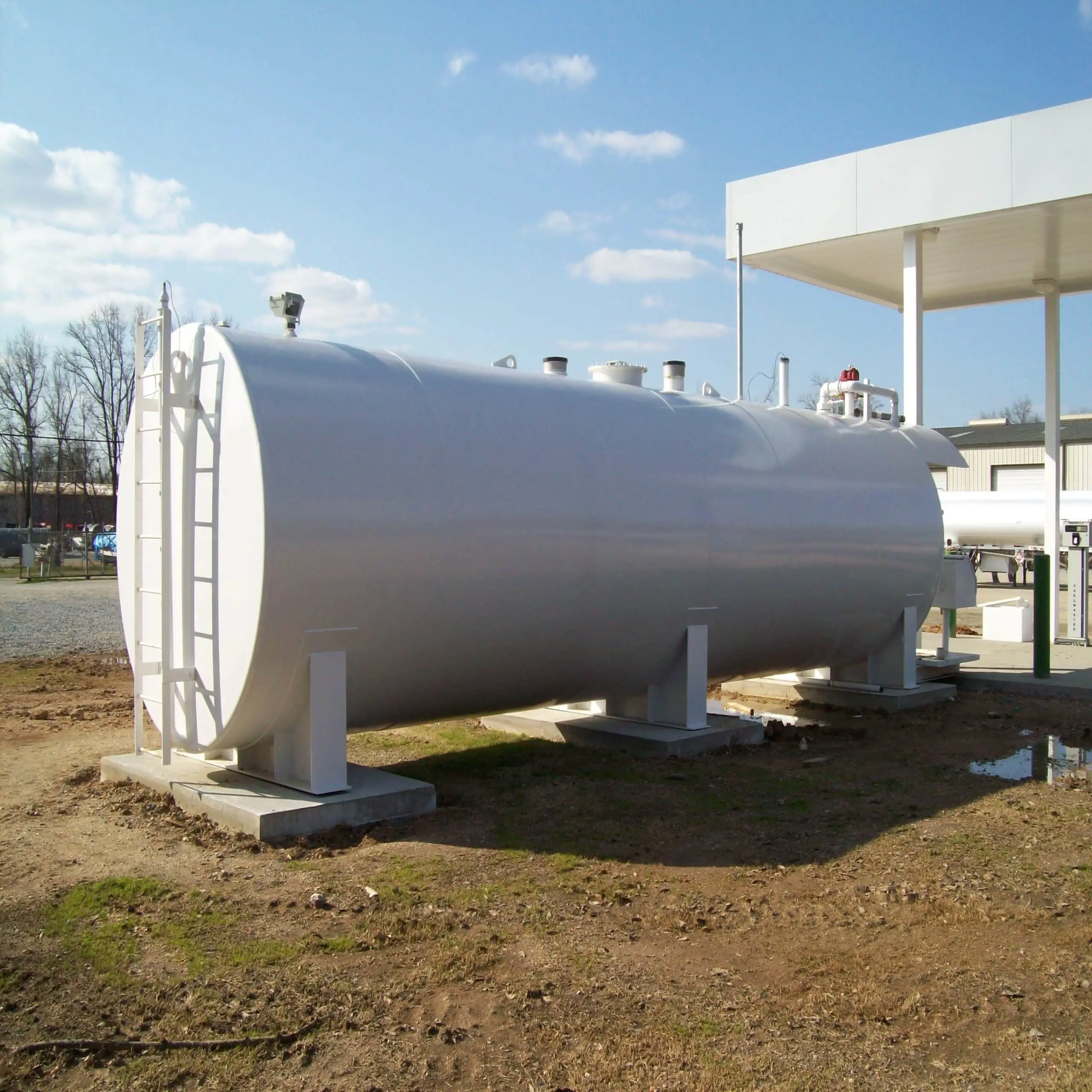 horizontal white abovegrouond oil storage tank