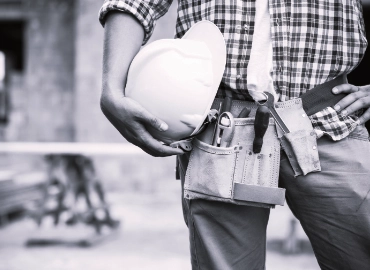 worker holding a helmet